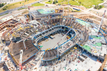 Large-scale construction of a stadium aerial view.