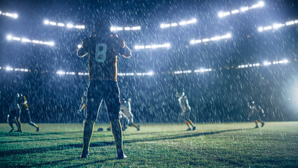 American Football Teams Compete: Substitution Athlete Warrior Stands on Stadium Field Ready to Win...