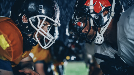 American Football Game Start Teams Ready: Close-up Portrait of Two Professional Players, Aggressive Face-off. Competition Full of Brutal Energy, Power, Skill. Rainy Night with Dramatic Light - obrazy, fototapety, plakaty
