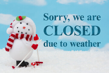 Closed due to weather with happy snowman skiing and snow with sky