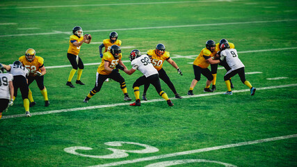 American Football Teams Start Game: Professional Players, Aggressive Face-off, Tackle, Pass, Fight for Ball and Score. Warrior Competition Full of Brutal Energy, Power, Skill.