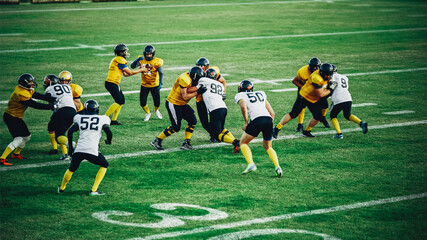 American Football Teams Start Game: Professional Players, Aggressive Face-off, Tackle, Pass, Fight for Ball and Score. Warrior Competition Full of Brutal Energy, Power, Skill.