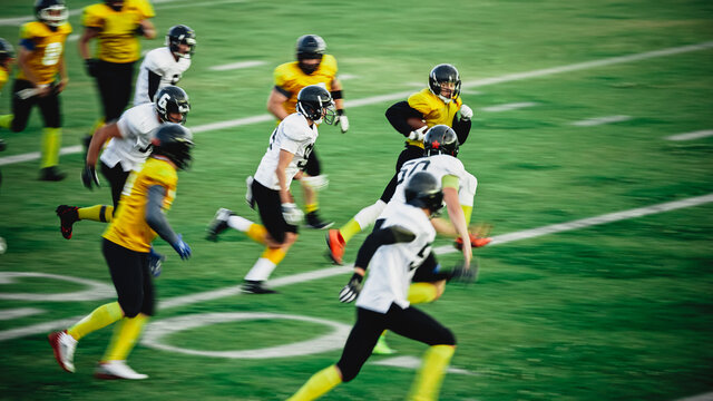 American Football Teams Start Game: Professional Players, Aggressive Face-off, Tackle, Pass, Fight for Ball and Score. Warrior Competition Full of Brutal Energy, Power, Skill. - Powered by Adobe