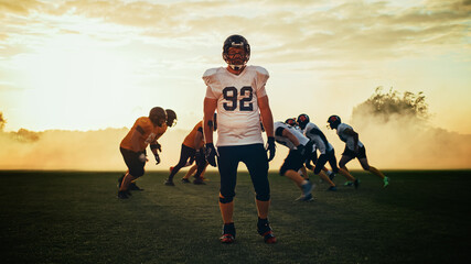 American Football Game: Portrait of a Tough Muscular Player Wearing Helmet, Posing, Looking at...