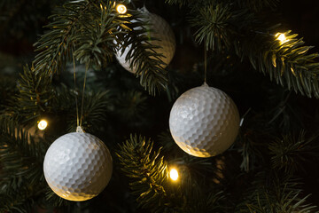 Golf balls as a xmas ornament in fir tree