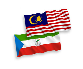 National vector fabric wave flags of Republic of Equatorial Guinea and Malaysia isolated on white background. 1 to 2 proportion.