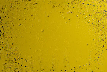 Yellow backgrond with water drops.