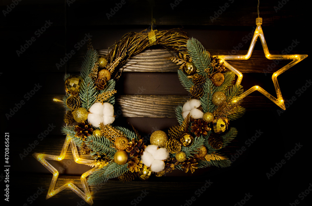 Wall mural christmas wreath on wood background