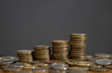 the steps from the stacks of coins. dark background, copy space