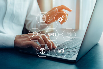 Closeup businessman working with laptop, SEO search engine optimization concept diagram with icon.