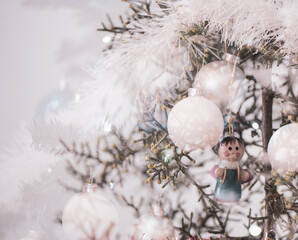 Fototapeta na wymiar Christmas themed background-White balls on a Christmas tree