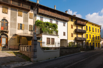 Fototapeta na wymiar Residential buildings in the historic town of Ampezzo in Udine Province, Friuli-Venezia Giulia, north east Italy 