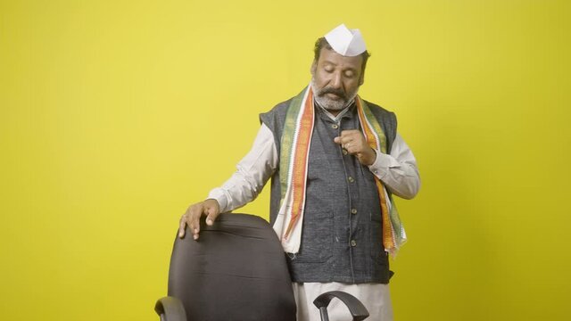 Greedy Politician thinking about power by seeing and walking around chair - concept showing of political dream to rule the society.