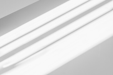 Obraz premium Abstract shadow and striped diagonal light background on white wall from window, architecture dark gray and sunshine diagonal geometric effect overlay for backdrop and design