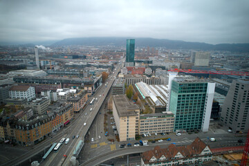 Obraz premium Aerial view of industrial district of City of Zürich with river Limmat on a cloudy grey autumn day. Photo taken November 15th, 2021, Zurich, Switzerland.