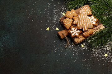 Christmas gingerbread cookies on textured table background