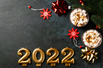 Christmas background with homemade hot chocolate, top view. Winter cocoa. New year drink. Flatlay with cocoa. Christmas composition with cocoa. Cosy drink. Number 2022