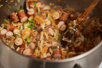 Turkey sausages dish with veggies, preparing
