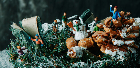 miniature people play on the snow, web banner