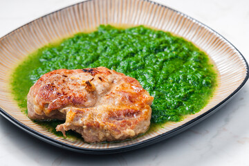 still life of pork cutlet with spinach