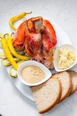 roasted pork knee with picked vegetables, bread and mustard
