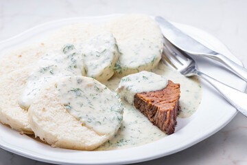 beef meat with dill sauce and dumplings