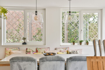 Interior of light dining room with windows