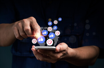Concept featuring notification icons similar to those shown above a smartphone screen, social media activities on a mobile phone, a man's left hand holding a device, and internet digital marketing.