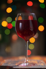 glass of red wine on bokeh background