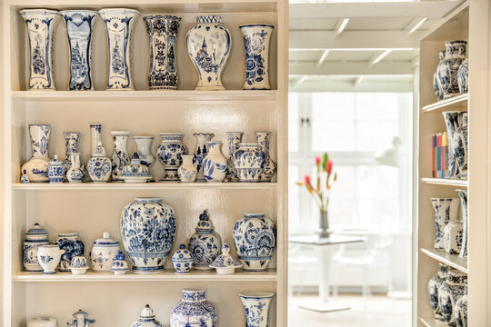 Gzhel styled vases on shelves