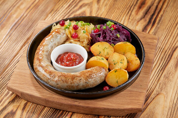 Traditional german fried meat with boiled potatoes, red cabbage and vegetables