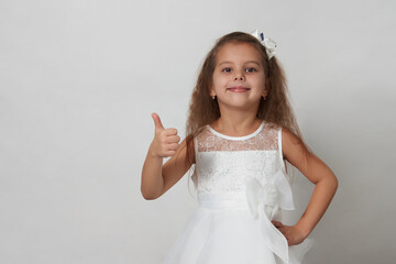Fototapeta na wymiar Cute girl portrait on a white background with copy space