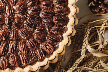 Baking dish with tasty pecan pie on table, closeup. Traditional holiday dessert for Thanksgiving or Christmas