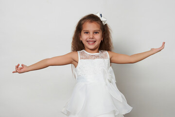 Naklejka premium Cute girl portrait on a white background with copy space