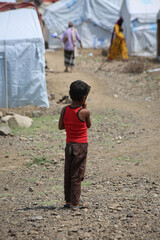  A sad child in a camp for displaced people from the war in Yemen, Taiz