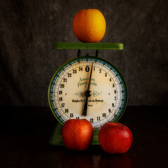 Studio Still Life of Apples and Oranges on an Antique scale