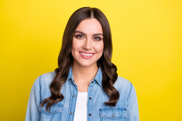 Fototapeta premium Photo of adorable charming young lady wear jeans shirt smiling isolated yellow color background