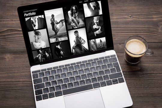 Artistic black and white photography website on the screen of laptop computer