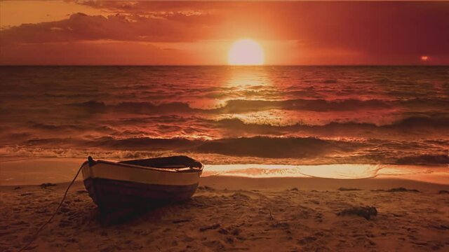 Lonely boat at sea shore at sunrise with big sun reflecting in the water. Beautiful fantasy shot. Symbol of loneliness, travel. Visual loop.