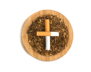 dried tobacco in a bowl on a white background