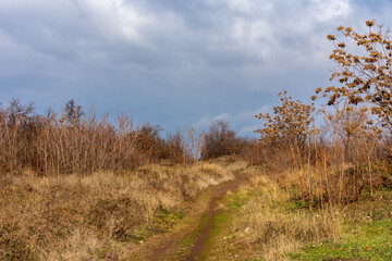 Fototapeta premium Industrial zone in the city. Collapse zone. Iron ore mining. Industrial tourism. Picturesque scenes. Kryvyi Rih, Ukraine.