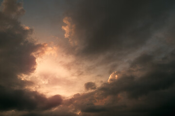 Fototapeta na wymiar Heaven sky during sunset. Summer sky full of orange sunlight