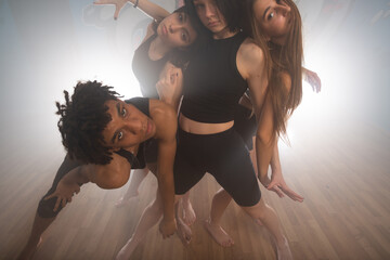 Group of multiracial dancers are exercising and practicing in their studio in slow motion