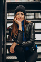 Young woman sitting on the stairs