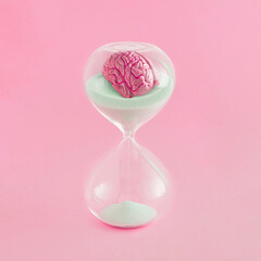 Conceptual, surreal, retro futuristic scene with a model of a leaking human brain, in an hourglass,...