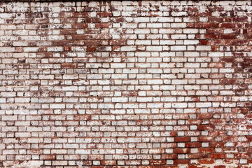 
brick wall red with white paint that has faded away over years of weathering. Horizontal photograph, photo of long-lasting construction building good background, abstract, backdrop. USA architecture 