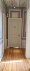 A vertical photo of a door in a hotel