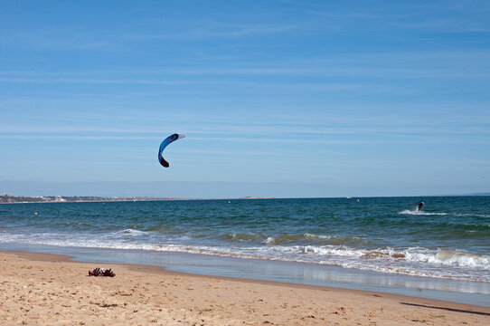 Kite surfing on the beach.
