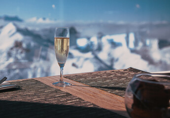 champagne and snowy mountains winter holiday