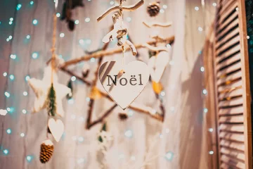 Fotobehang hanging Christmas decorations and lights noel © Melinda Nagy